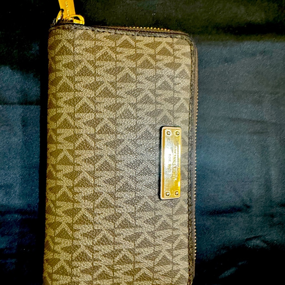 Coach brown and tan leather zip wallet. Good shape with little wear
